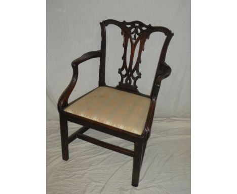 A George III mahogany Chippendale-style carver armchair with pierced vase splat back and upholstered seat on square legs