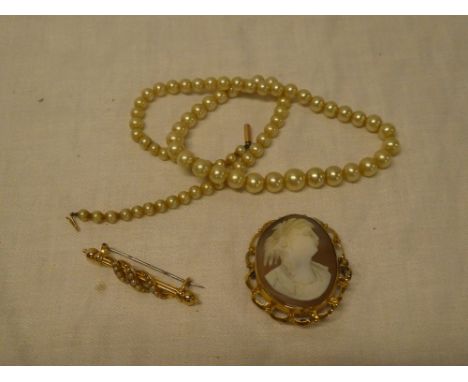 A 15ct gold bar brooch set seed pearls, 9ct gold oval brooch set female portrait cameo and a cultured pearl necklace with 9ct