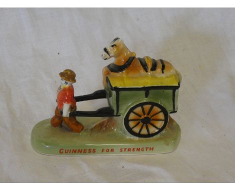 A Carltonware china Guinness advertising figure of a farmer pulling a cart with horse riding on top "Guinness for Strength"