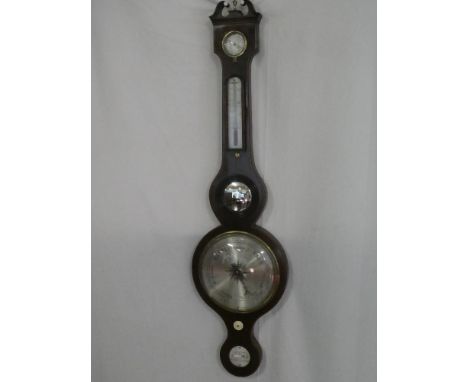A 19th Century mercury barometer with silvered dials by G Moltini Newcastle-on-Tyne with thermometer, dry/damp dials and mirr