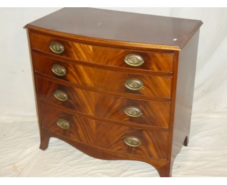 A good quality small polished mahogany bow front chest of four long graduated drawers with brass ring handles on bracket feet