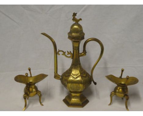 A pair of small Chinese brass candle holders on three scroll legs and an Eastern brass baluster-shaped ornamental coffee pot 