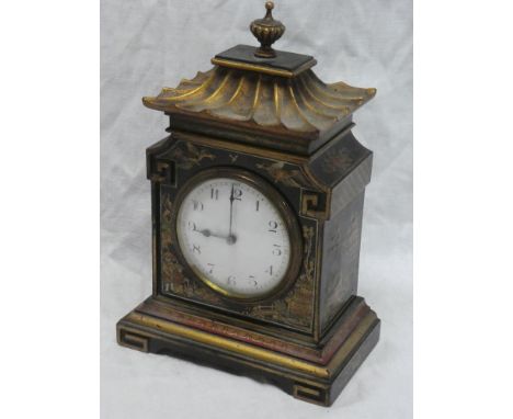 A good quality Chinese-style mantel clock with circular enamelled dial in gilt and lacquered pagoda-style case 9 1/2" high