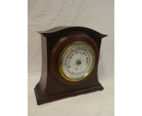An Edwardian aneroid barometer with china circular dial in brass mounted mahogany tapered case