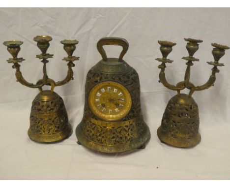 A reproduction brass mantel clock in the form of a bell with circular decorated dial and individual porcelain numerals, 12½" 