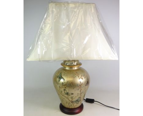 Oriental style gold effect table lamp decorated with butterflies, in wood plinth, as new in original packaging, H64cm    Cond