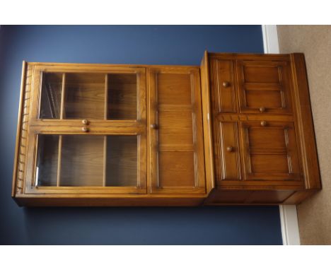 'Ercol' golden dawn finish elm wall unit, raised display cabinets above fall front, cupboards and drawers, W98cm, H197cm, D50