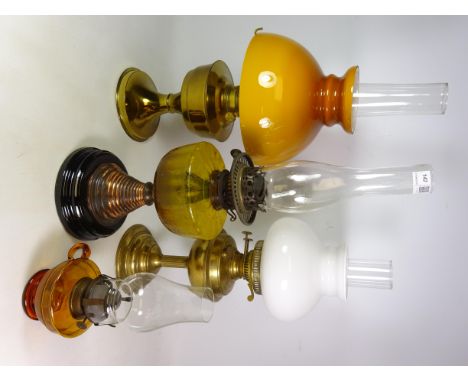 Victorian amber glass finger lamp, Victorian oil lamp and two later oil lamps (4)   Condition Report   Click here for further