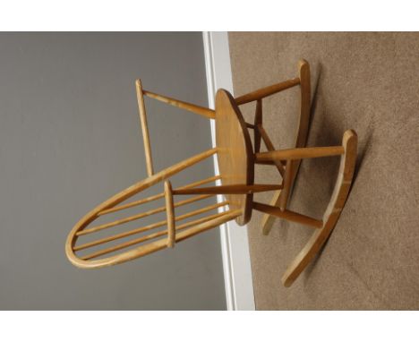 Ercol 'Windsor' light elm and beech rocking chair and an Ercol wall hanging plate rack   Condition Report   Click here for fu