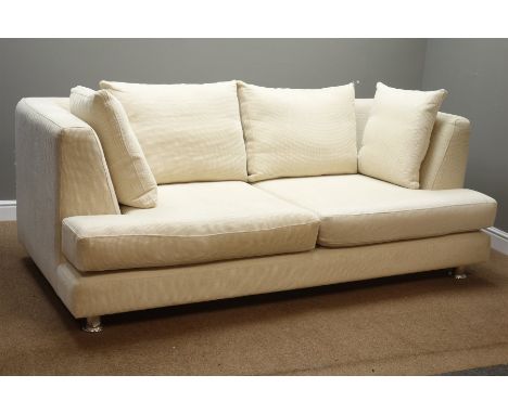 Large three seat sofa upholstered in cream fabric, chrome feet, W217cm