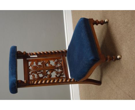 Victorian walnut prie dieu chair, with barley twist supports, carved scrolling fret work back with centre crucifix, turned fe