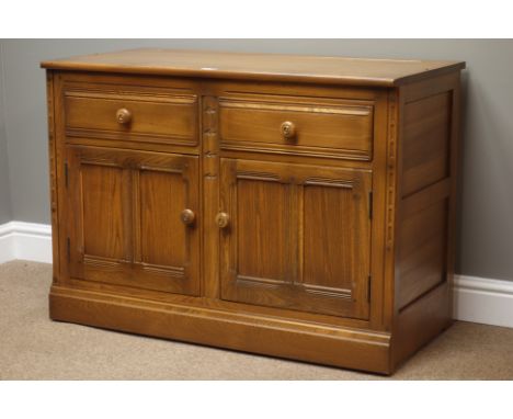 'Ercol' golden dawn finish elm sideboard, two drawers and two cupboards, W98cm, H70cm, D50cm   Condition Report   Click here 