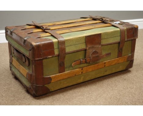 Early 20th century green canvas and leather bound travelling trunk, W72cm   Condition Report   Click here for further images,