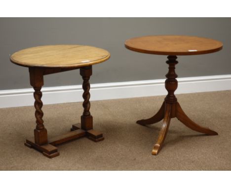 Reproduction circular walnut top occasional table on tripod base and a medium oak circular occasional table on barley twist s