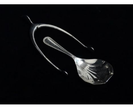 A silver caddy spoon and a pair of wishbone sugar nips, boxed - Birmingham 1959, Garrard &amp; Co., weight 26g.