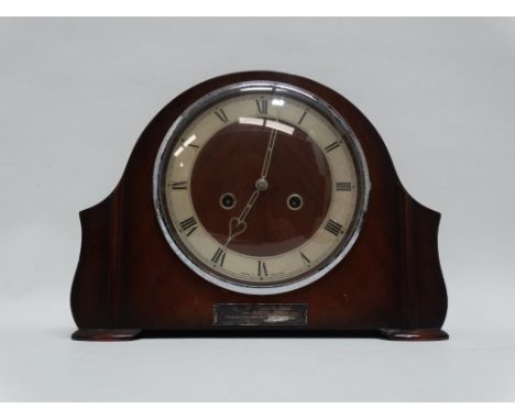A Smiths mid 20th century mahogany cased mantel clock - with silvered chapter ring set out in Roman numerals, bearing present