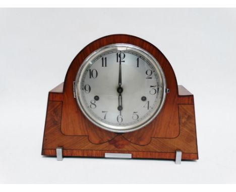 An Art Deco style walnut mantel clock - the silver dial set out in Arabic numerals with a tree train striking movement, 24cm 