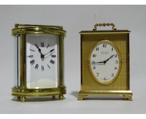 A 20th century carriage timepiece - fitted with a French movement, the white enamel dial set out in Roman numerals, the oval 