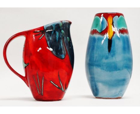 A Poole Pottery jug - iris flower decoration, on a mottled red ground, height 22cm, together with another Poole Pottery vase 
