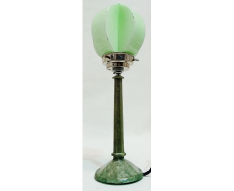 An Art Deco style green marbled Lucite table lamp - of faceted tapering form on a circular base, with an unusual segmented gr