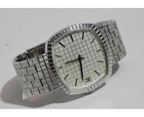 A gentlemans wristwatch - a 1970s stainless steel manual wind bracelet wristwatch, unsigned, with 30mm silver engine turned d