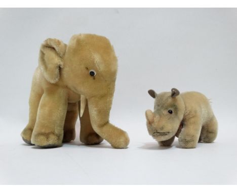 A 20th century plush elephant - possibly Steiff, blond with bead eyes and painted detailing, height 16cm, together with a Ste
