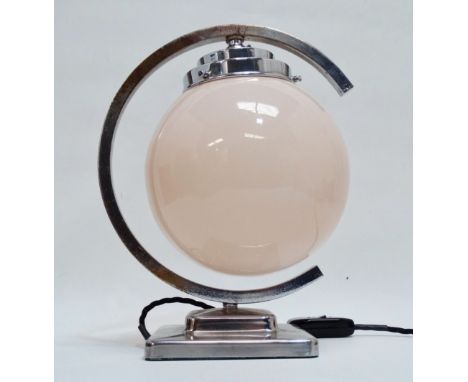 An Art Deco chrome desk lamp - the blush pink globe shade within a C-shaped support and square stepped base, height 30cm.