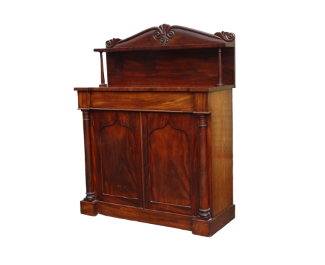 An early Victorian mahogany chiffonier - the foliate raised back with a shelf above an inverted breakfront, drawer and ogee a