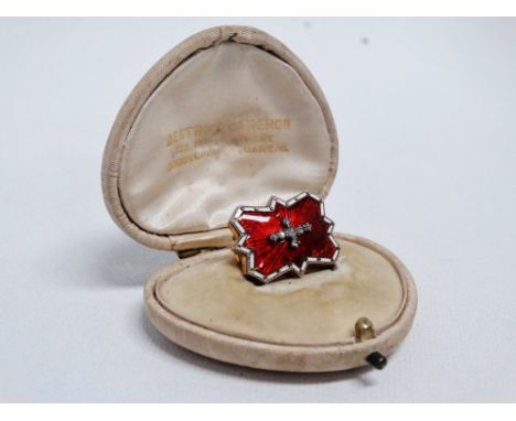A late 19th century red enamel brooch - set with old mine cut diamonds, the brooch of rectangular shaped form, length 2.5cm, 
