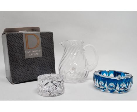 A Dartington crystal jug - of spiral ribbed form, boxed, height 16cm, together with a clear and turquoise cut glass ashtray a