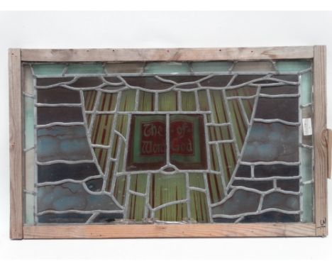 An early 20th century stained glass panel - the panel titled 'The Word of God' 46 x 77cm (including temporary framing).