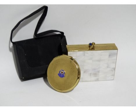A Stretton powder compact - circular with Morris motors logo, together with a Volupte evening bag/compact
