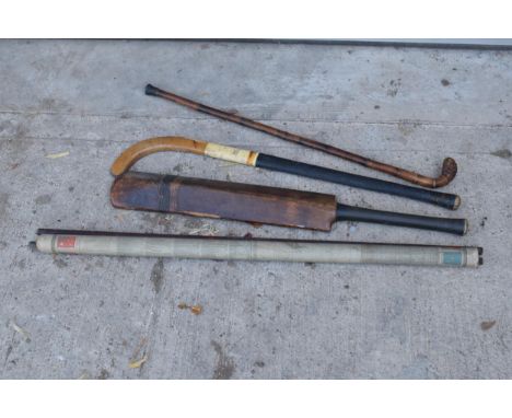 A mixed collection of items to include an E J Riley Ltd cricket bat, Grays of Cambridge hockey stick, a walking stick and a l