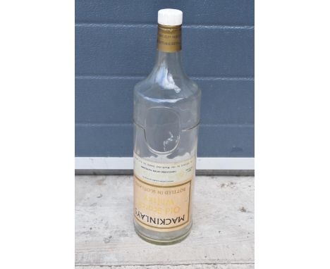 Mackinlay's Old Scotch Whiskey large bottle. 48cm tall. In good condition. 