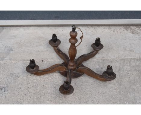 An early to mid 20th century wooden light candelabra style fitting for 5 candles. 