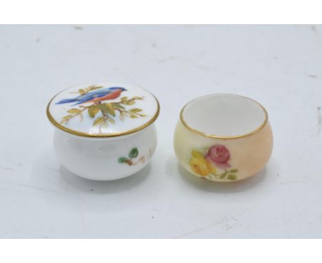 A pair of Royal Worcester miniature pots to include a floral scene and a bird amongst foliage (2). In good condition with no 
