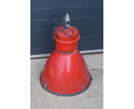 A large 20th century metal industrial hanging light in a red colourway. 72cm tall. Untested.
