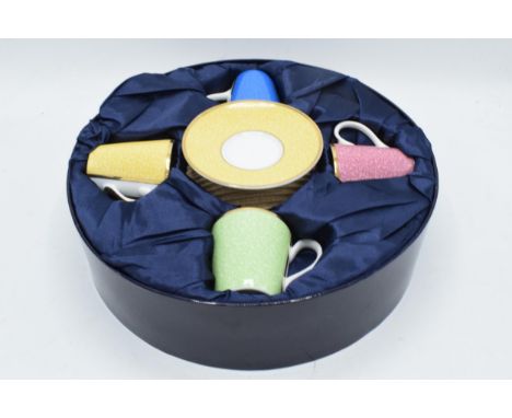 A cased Royal Worcester set of 4 cups and saucers in different colours in Celebration of HRH 80th Birthday 2006. In good cond