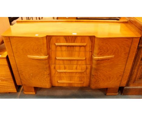 Art Deco walnut sideboard by Fryers of Eccles & Stockport with four central drawers & side cupboards