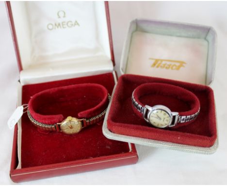 9 ct gold ladies Omega mechanical 1960s boxed watch in working order at lotting up plus a boxed Tissot ladies wristwatch