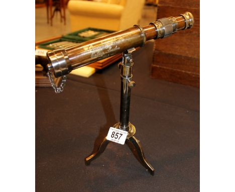 Brass telescope on tripod base
