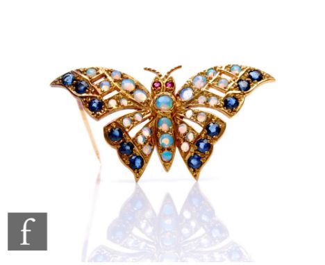 A 9ct hallmarked opal, sapphire and ruby stone set brooch modelled as a butterfly, weight 5.6g, width 40mm. 