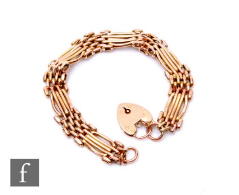 A 9ct rose gold five bar gate bracelet, weight 11.5g, terminating in padlock fastener, damaged. 