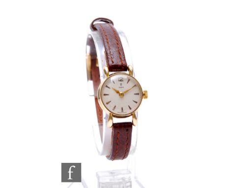 A lady's 10ct manual wind Tudor wrist watch, batons to a circular dial, case diameter 20mm, cased. 