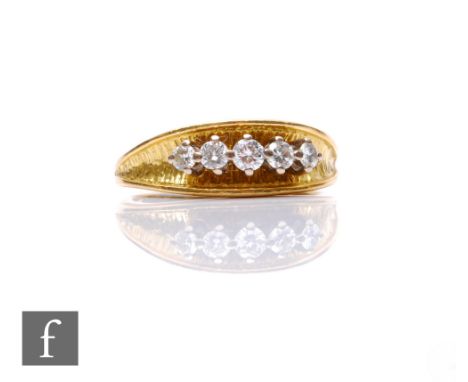 An 18ct hallmarked diamond five stone ring, high claw set stones to a bark effect finished head, weight 6.5g, ring size R 1/2
