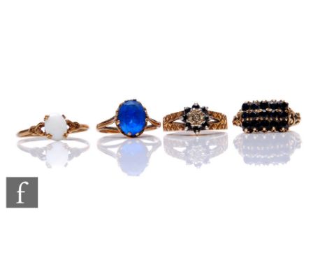 Four assorted 9ct hallmarked stone set rings to include opal and sapphire examples, total weight 9g. (4) 