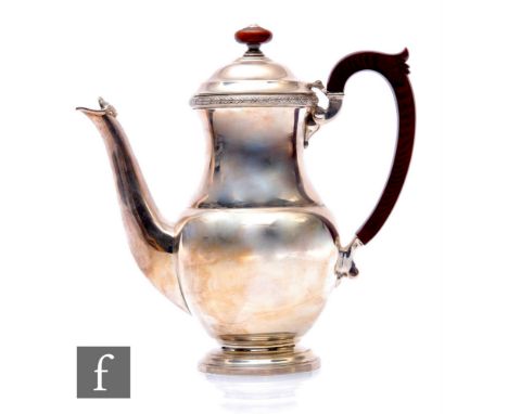A hallmarked silver baluster coffee pot of plain form weight 19.5oz, height 21cm, terminating in turned wooden handle and but