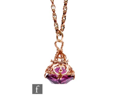 An early 20th Century 9ct rose gold fancy link chain, weight 8g, length 50cm, with a later 9ct mounted amethyst fob. 