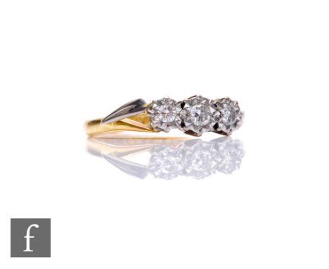 An 18ct hallmarked illusion set diamond three stone ring, weight 3.1g, ring size M. 