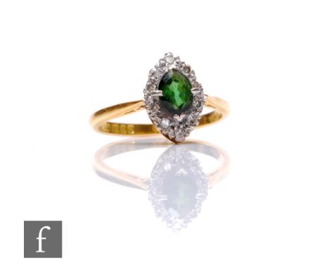 An 18ct hallmarked green garnet and diamond marquise shaped ring, central garnet within diamond set borders, weight 3.3g, rin
